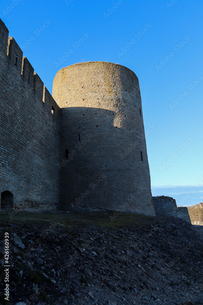 medieval Ivngorod fortress wall and tower at the evening