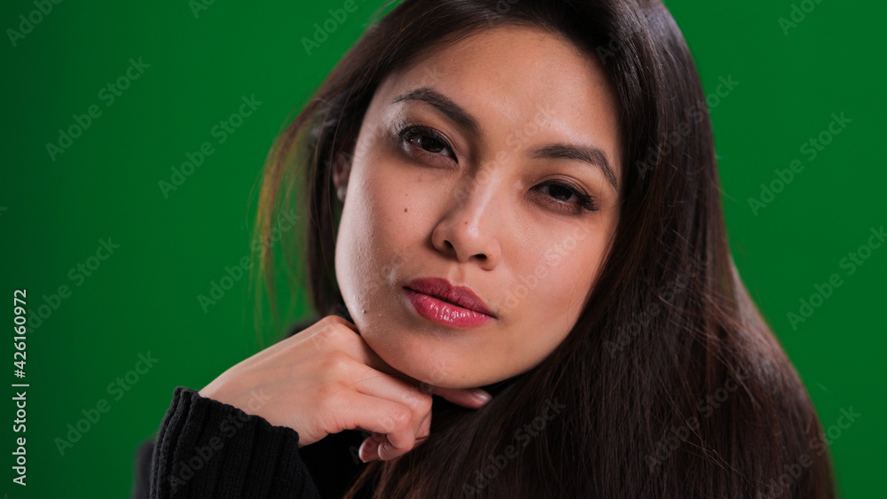 Close-up of a pretty young woman with asian appearance - studio photography Close-up of a pretty young woman with asian appearance - studio photography