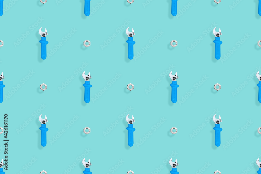 Wrench with nut seamless pattern. Background on the theme of repair or construction. 