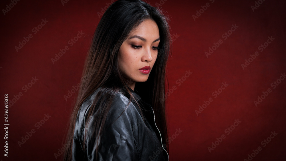 Young Asian woman in profile - studio photography Young Asian woman in profile - studio photography