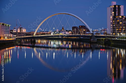 Night view of the Clyde Arc or Squinty Bridge from the East and river Clyde, Glasgow, Scotland © George