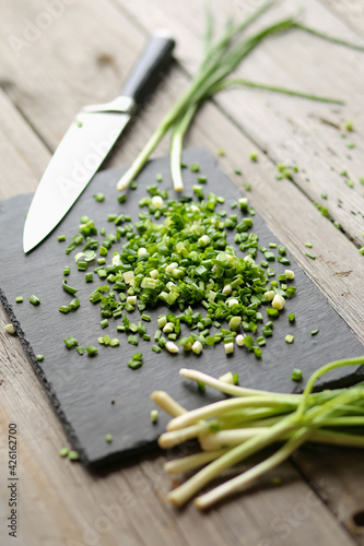 Green chopped onion on a board