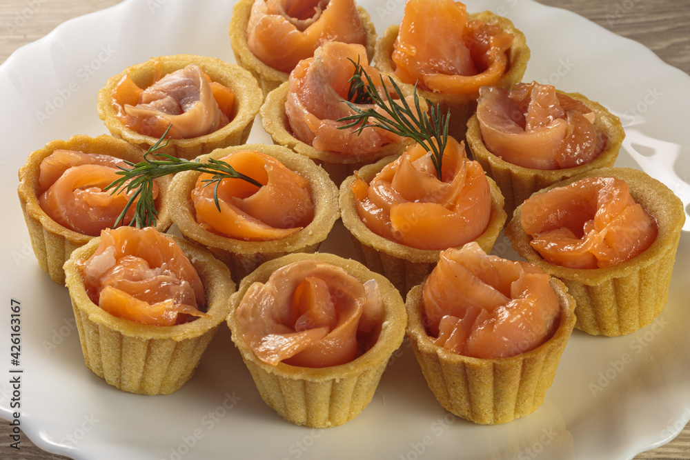Tasty tartlets with salted salmon. - obrazy, fototapety, plakaty 