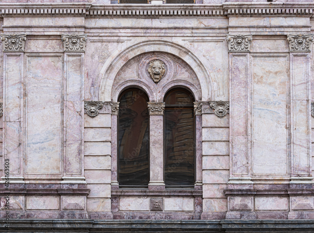 Windows on old city facades, with decorative elements