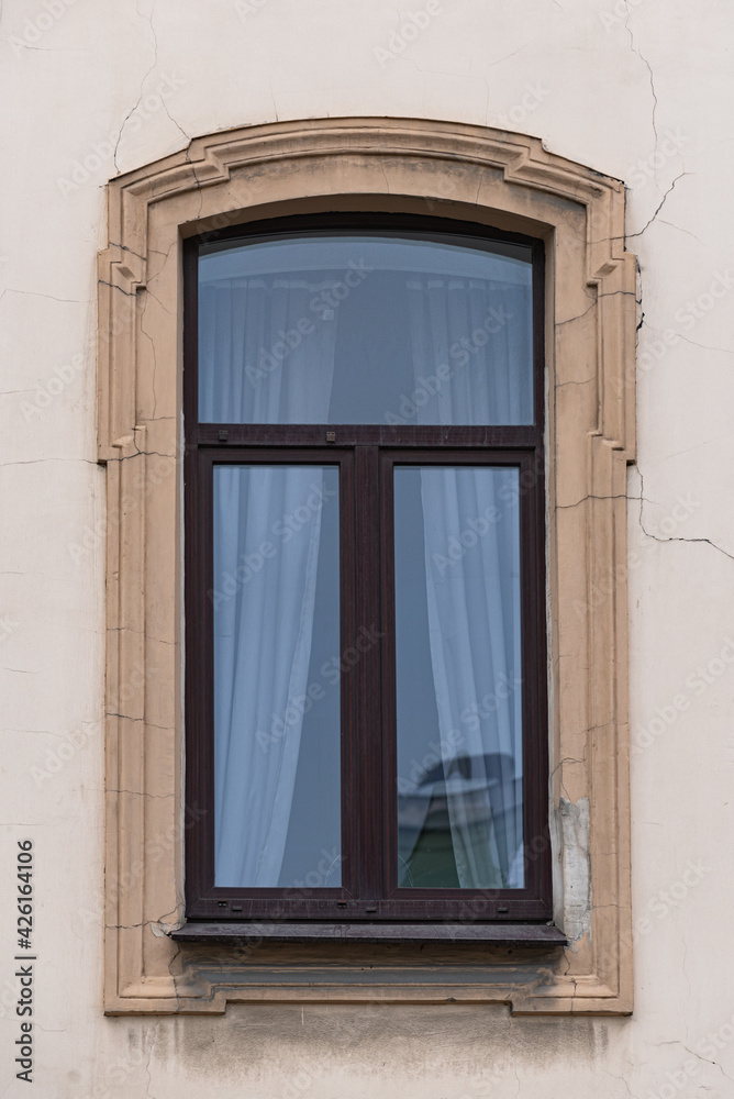 Windows on old city facades, with decorative elements