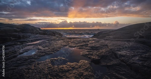 Sunset timelapse of coastal landscape. Dramatic scenery. photo