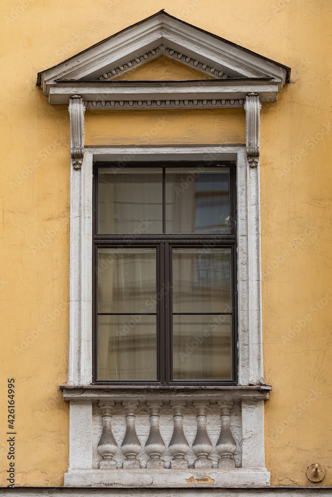 Windows on old city facades, with decorative elements