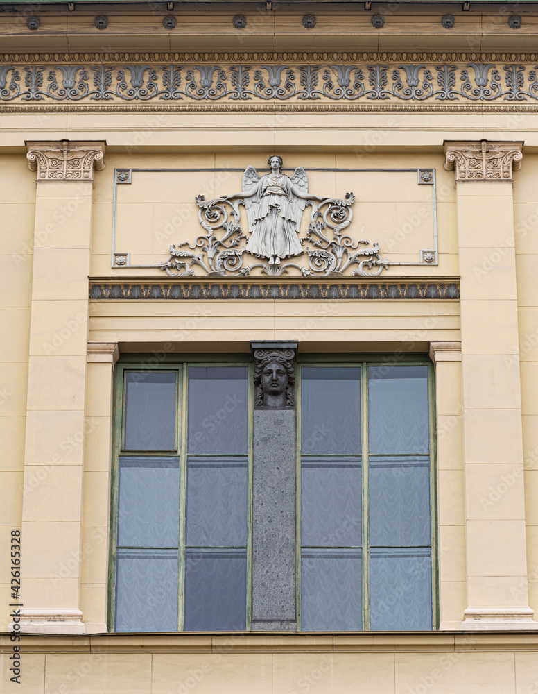 Windows on old city facades, with decorative elements Windows on old city facades, with decorative elements
