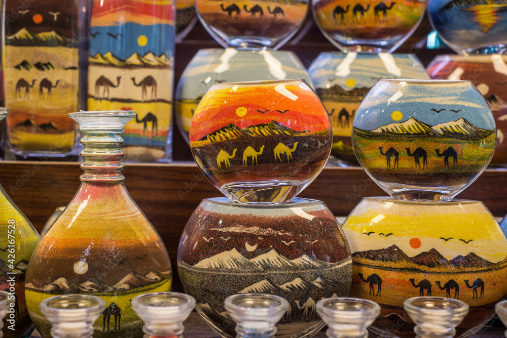 Extreme close up of sand art in the bottle from United Arab Emirates. Popular gift souvenirs from the Middle east.