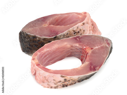 Carp steaks on white background, close up