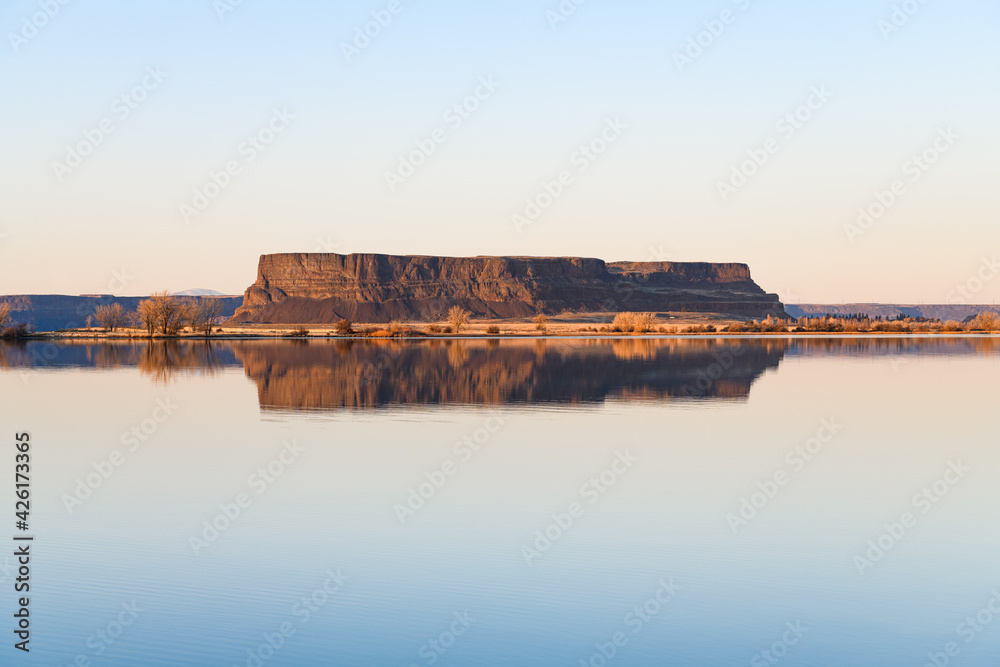 Steamboat Rock reflecting in a perfectly smooth Banks Lake in Central Washington State