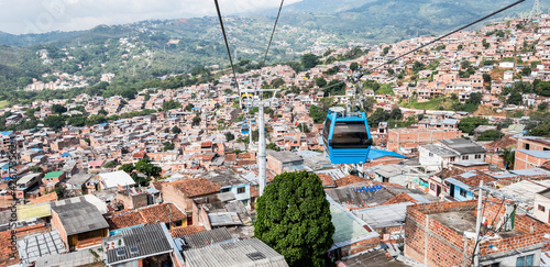 Cityscape with houses and MIO cable car with blue sky. Cali, Valle del Cauca, Colombia. photo