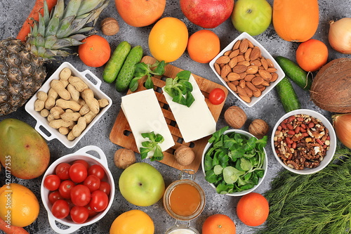 Fototapeta Naklejka Na Ścianę i Meble -  Fresh fruits and vegetables with vitamin C for strengthening the immune system and losing weight, detox diet concept, healthy natural diet food. Food delivery, selective focus,