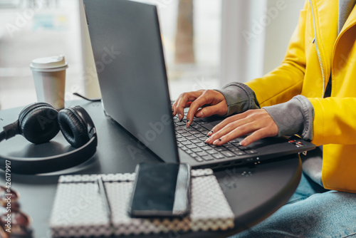 Woman hands using a laptop in the office