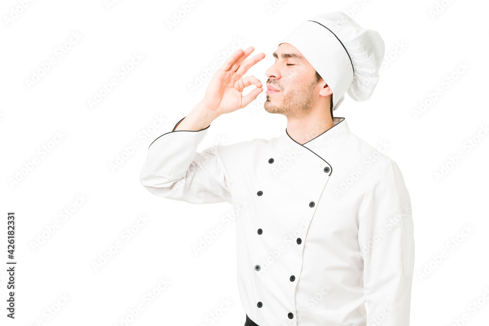 Successful chef finishing a delicious menu at a restaurant Successful chef finishing a delicious menu at a restaurant