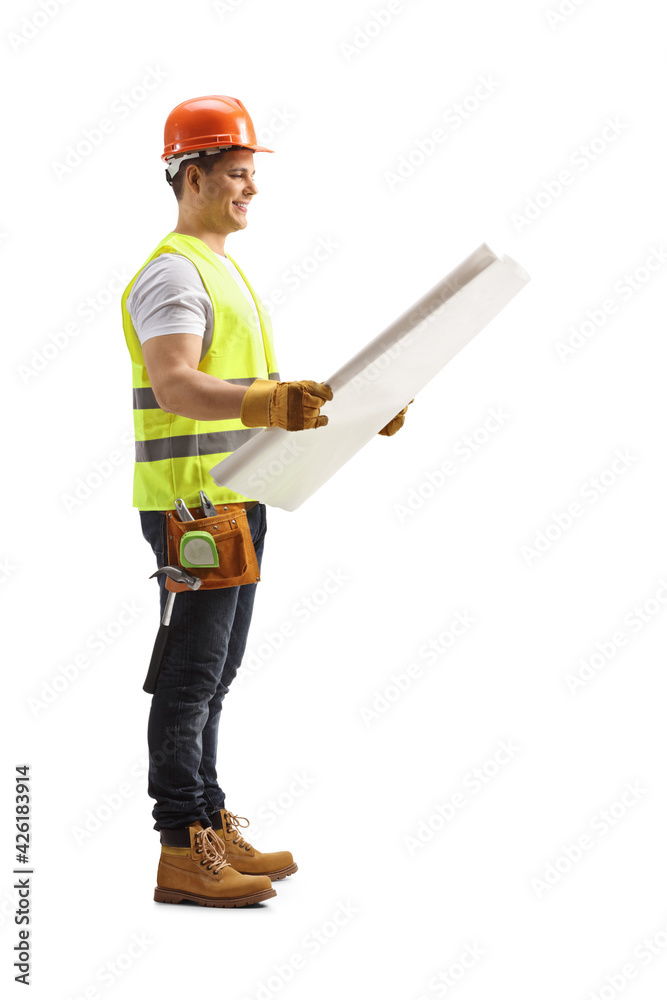 Full length profile shot of a construction worker looking at a blueprint Full length profile shot of a construction worker looking at a blueprint