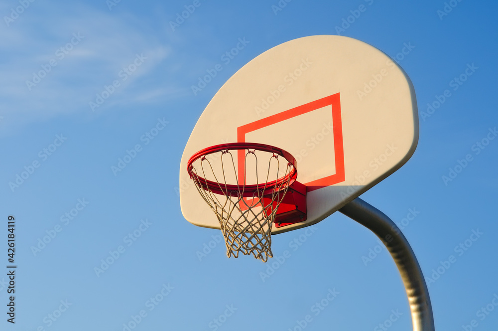 Basketball net against a blue sky