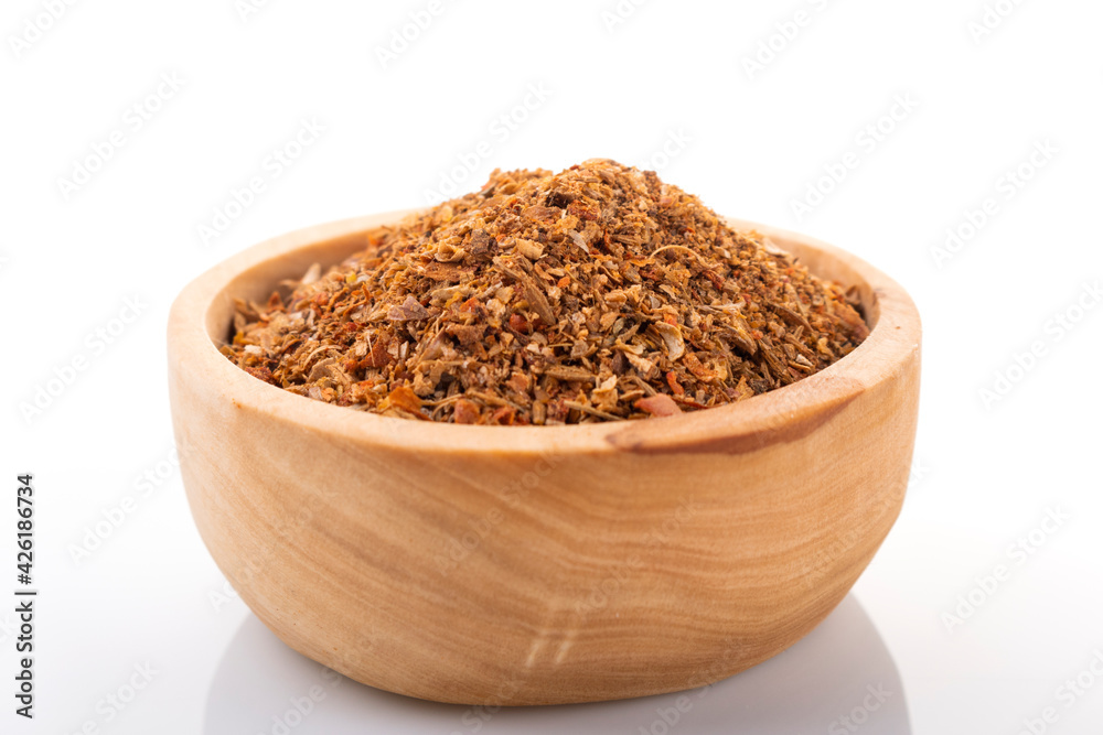 Ras el hanout moroccan spice. Ras el hanout in wooden bowl, on white background. Moroccan spice Ras el hanout moroccan spice. Ras el hanout in wooden bowl, on white background. Moroccan spice