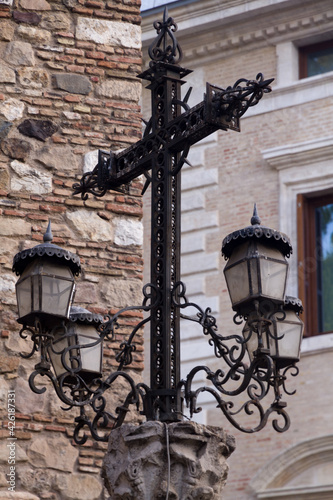 An old Metal Lamp in the Shape of a Cross
