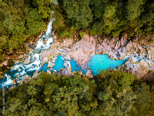 Blue natural pool in the middle of the mountain
