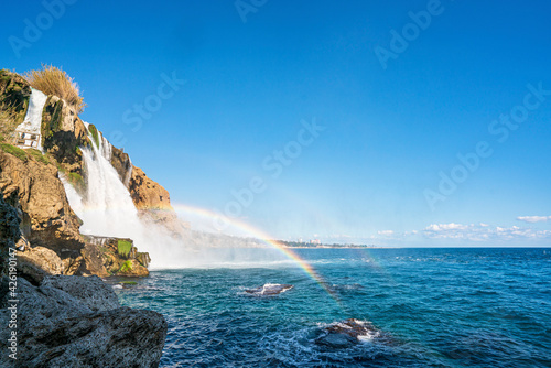 The scenic view of Düden waterfall and rainbow on a sunny day from different sea levels in Antalya photo