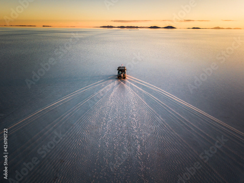 Van in the salar of Uyuni incredible sunset