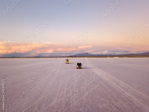 Van in the salar of Uyuni incredible sunset