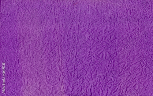 Purple crumpled paper texture. Purple paper texture background or cardboard surface from a paper box for packing. and for the designs decoration and nature background concept. Recycled craft paper 