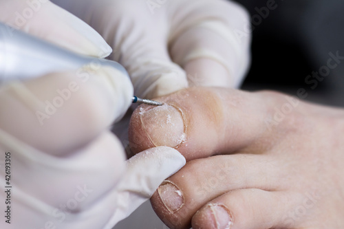Foot care in a beauty salon. Foot massage by a close-up specialist. Space for text