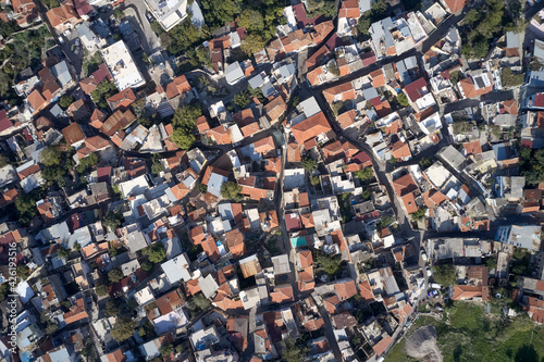 Photos Top view of houses with red roofs.