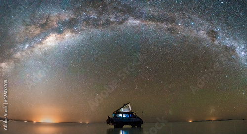Milky way in the Salar of Uyuni, car silhouette