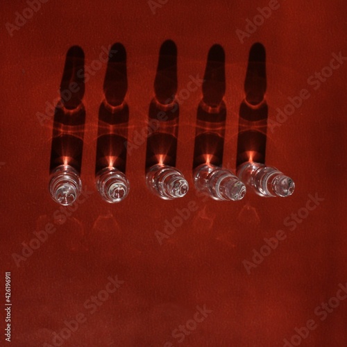 ampoules on a brown backgound