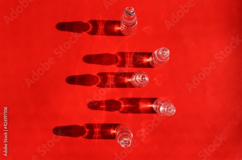 ampules on a red backdrop