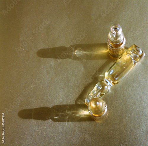 vitamine ampules on the silver background