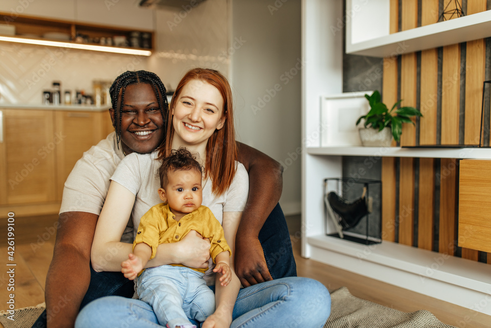 Portrait of a happy mixed race family at home. Portrait of a happy mixed race family at home.