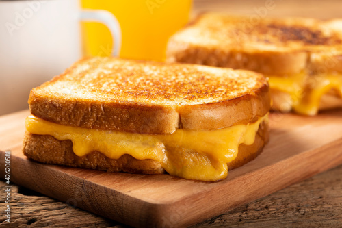 Grilled ham and cheese. Sandwich with cheese and ham on grill. photo