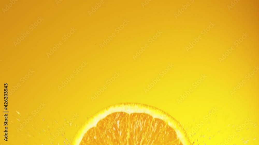 Super slow motion of orange slice falling into juice. Filmed on high speed cinema camera, 1000 fps. Super slow motion of orange slice falling into juice. Filmed on high speed cinema camera, 1000 fps.