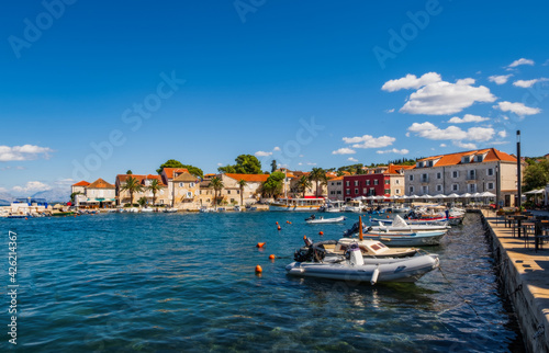 Sutivan, Croatia - August 2020: Locals and tourists enjoying sunny summer day in the small town Sutivan, island Brac, Croatia.