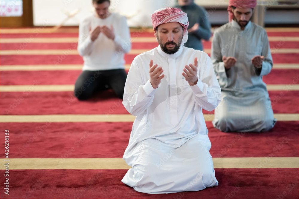 group of muslim people praying namaz in mosque. group of muslim people praying namaz in mosque.
