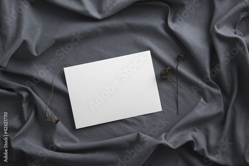 Blank greeting invitation card mock-up on a stone. 
