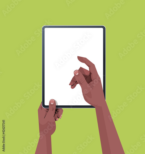 african american human hands holding tablet pc with blank touch screen using digital device concept