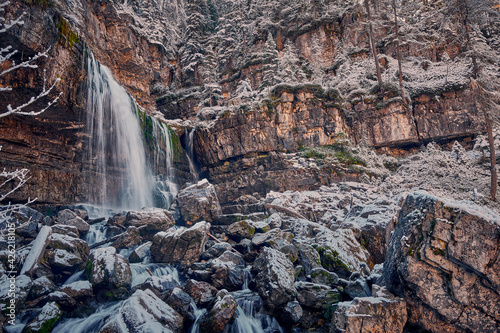 Beautiful Waterfall Vallesinella in Madonna di Campiglio in the autumn time, National Park Adamello-Brenta,Trentino,Italy Dolomites photo