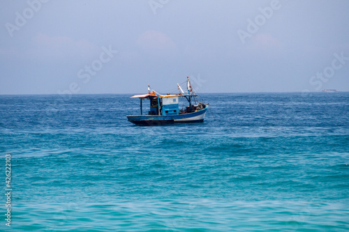 fishing boat over the sea at Ipanema beach in rio de janeiro.