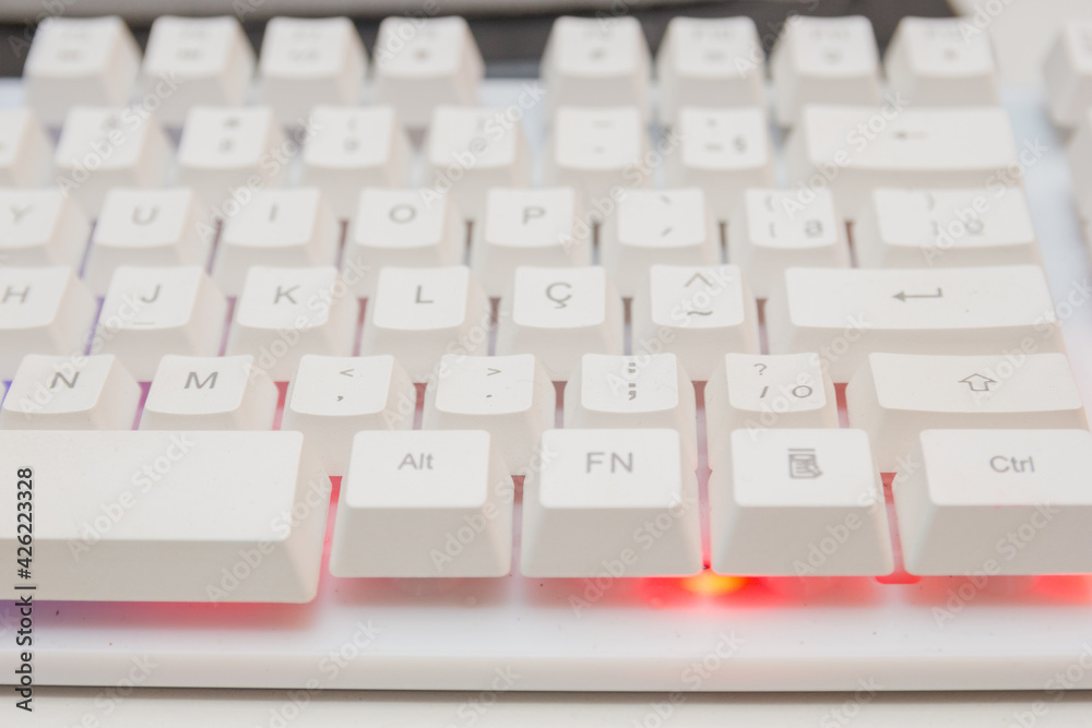 white gamer keyboard with colorful lights in rio de janeiro. white gamer keyboard with colorful lights in rio de janeiro.