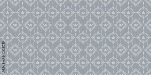 Background pattern with ornament in the royal style on a silver background. Seamless wallpaper texture for your design