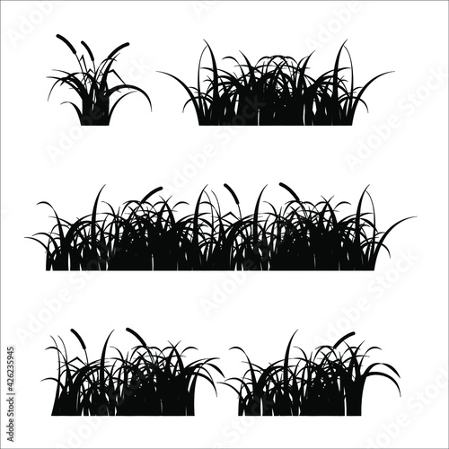 Set of dark silhouettes of meadow grasses on a white background. Vector illustration, flat minimal design, isolated on white background, esp 10.