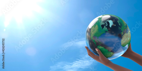Fotografie A conceptual illustration of the planet earth on the outstretched arms of a black woman