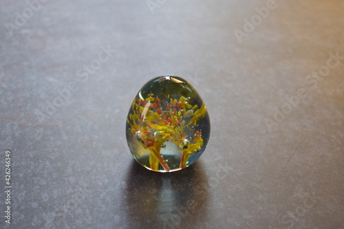 Translucent small glass paperweight isolated 