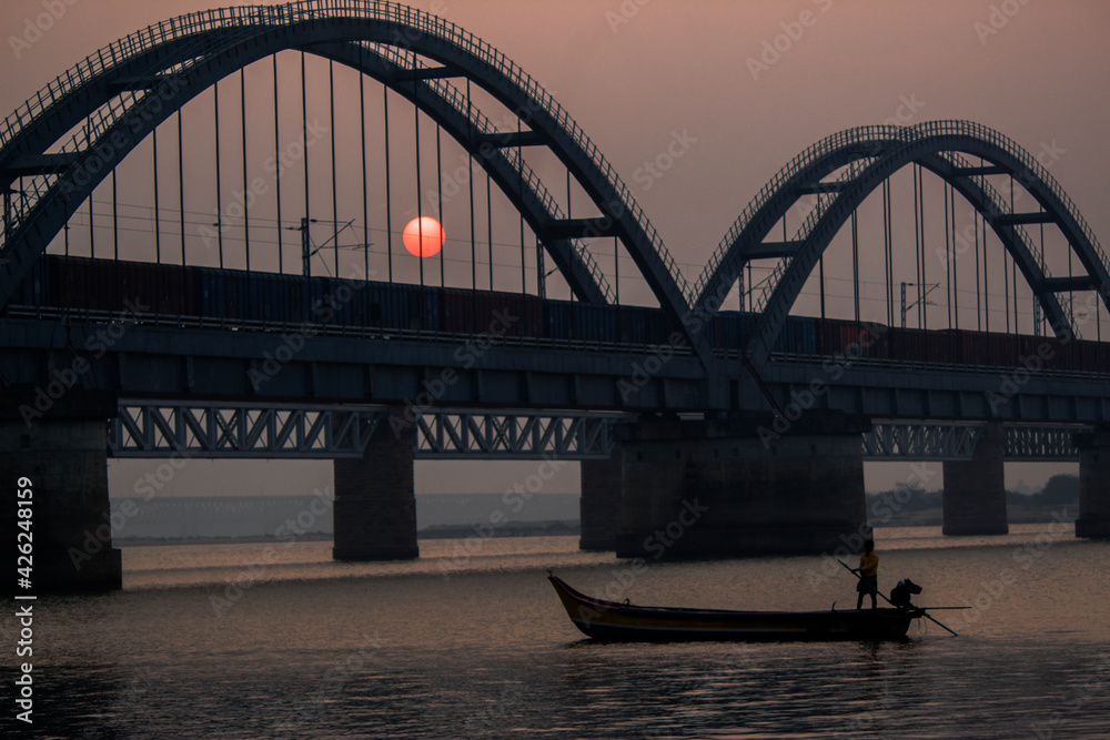 Fototapeta premium The Godavari Arch Bridge is a bowstring-girder bridge that spans the Godavari River in Rajahmundry, India. It is the latest of the three bridges that span the Godavari river at Rajahmundry. 