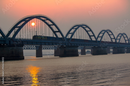 The Godavari Arch Bridge is a bowstring-girder bridge that spans the Godavari River in Rajahmundry, India. It is the latest of the three bridges that span the Godavari river at Rajahmundry.  © Veerababu